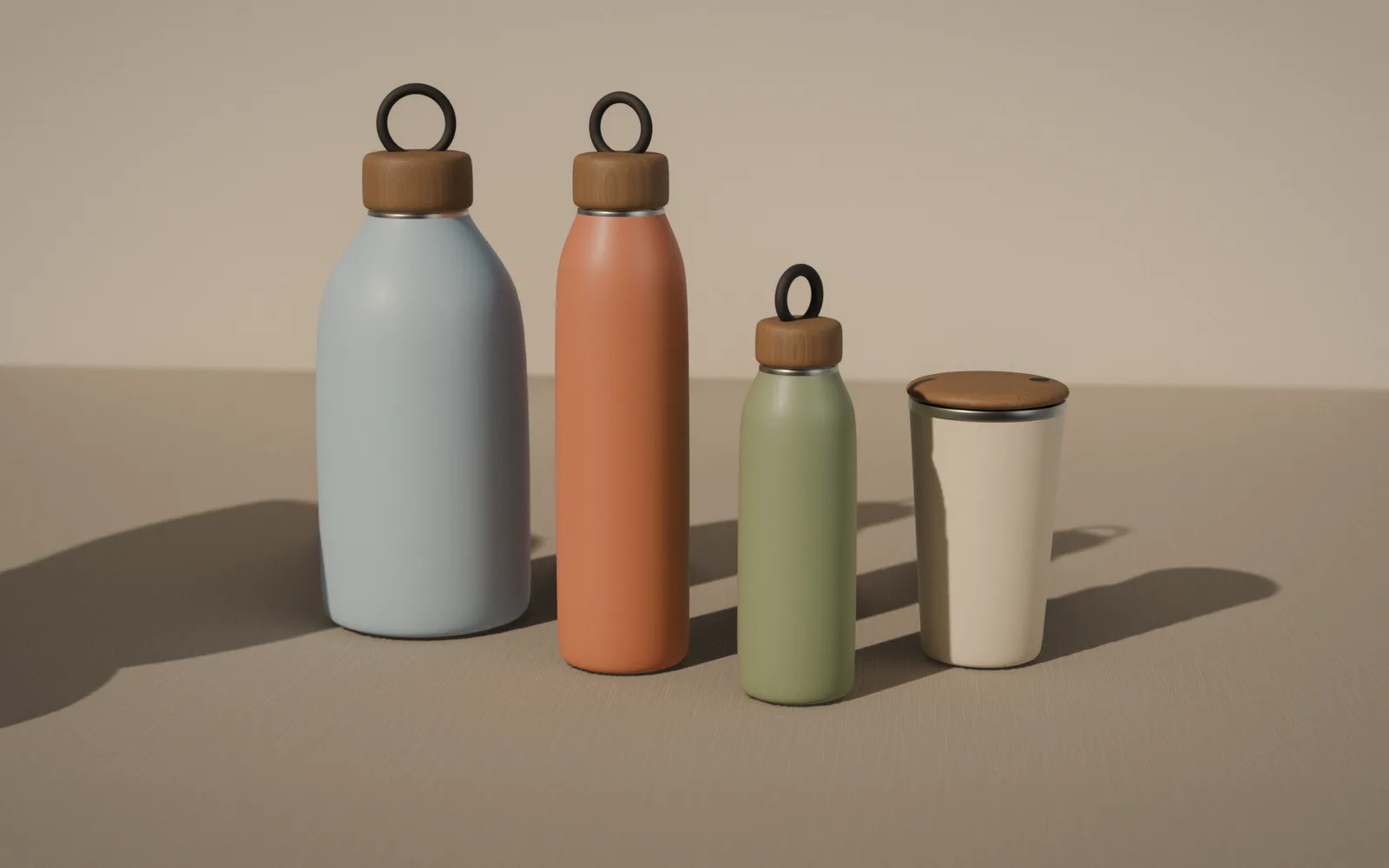 The four rill vessels on linen in low sun: the Jug in sky, the Bottle in clay, the Mini in moss and the Cup in sand